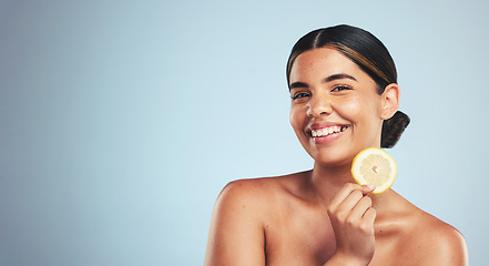 Image showing Portrait, lemon and happy woman in studio for skincare, wellness or organic, beauty or skin detox on grey background, Fruit, smile and face of lady model with citrus facial for collagen or anti aging