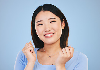 Image showing Happy, Asian and portrait of a woman on a blue background for cosmetics face headshot. Smile, beauty and a girl or model with dental care, beautiful and makeup for cheerful personality in studio