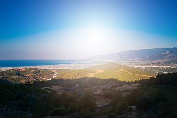 Image showing Sunrise on the sea and mountains