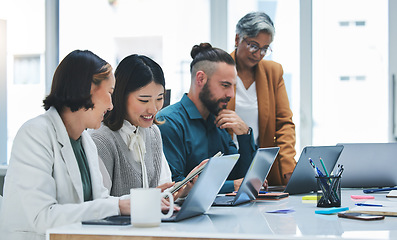 Image showing Business people, laptop and meeting, marketing team and creative group at digital agency with research online. Man, women and diversity, working together and senior leader with branding strategy