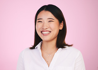 Image showing Portrait, happy and asian woman laugh in studio with funny, joke or silly humor on pink background. Comic, smile and face of female model laughing to goofy, comedy or playful, good mood or positivity