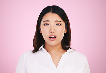 Image showing Wow, shock and surprise, portrait of asian woman with confusion for giveaway news or announcement in studio. Gen z girl with surprised face, emoji or meme isolated on pink background with mockup.