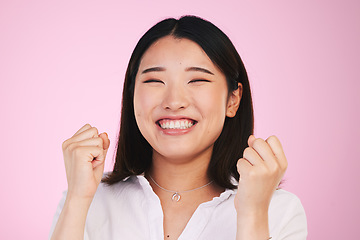 Image showing Happiness, studio face and asian woman celebrate success, achievement or winning promotion deal, giveaway or competition. Prize winner, award celebration or Japanese person excited on pink background