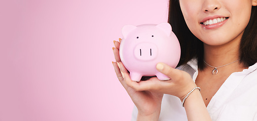 Image showing Woman, piggy bank and mockup space in savings, investment or financial growth against a pink studio background. Female person, banner and hands holding piggybank in finance or profit on mock up
