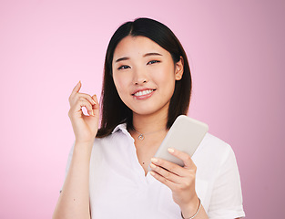 Image showing Search, phone and social media with portrait of woman in studio for networking, communication and internet. Website, post and gen z with Asian person on pink background for technology and mobile app