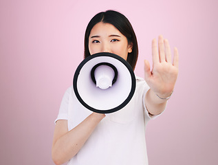 Image showing Megaphone announcement, portrait and Asian woman with stop hand sign for justice, human rights rally and end racism. Warning speech, studio and Japanese female speaker revolution on pink background