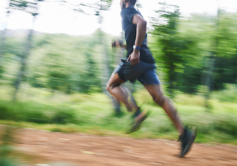 Image showing Sports man, speed and running in forest with motion blur, cardio workout and exercise action. Runner, fast athlete and training for marathon challenge with energy, dynamic fitness and power in park