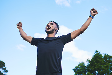 Image showing Runner man, fist celebration and nature with goals, achievement and pride for race, success and contest. Young athlete guy, happy winner and outdoor for fitness, competition and freedom in summer
