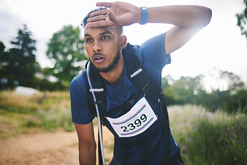 Image showing Runner man, race and tired in nature, thinking and rest for sweat, breathe or vision in woods for triathlon. Athlete guy, face and idea for strategy, fatigue or burnout in forest, marathon or hiking]