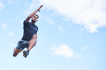 Image showing Runner man, jump and sky with space for mockup, clouds and fitness in nature, action and freedom. Athlete guy, low angle and outdoor for workout, exercise and training with fast moving for health