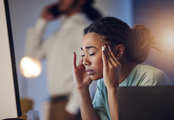 Image showing Tired, headache and a business woman in an office at night working late on deadline. African entrepreneur person with hands on head for pain, burnout or depression and mistake or fatigue at work