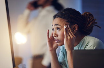 Image showing Business woman, anxiety and stress at computer in office at night working late on deadline. Tired African entrepreneur person with hand on head for pain, headache or burnout thinking of work crisis