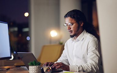 Image showing Night, business and man with laptop, typing and connection with programming, code and trading. Person, investor or accountant with a pc, stock market and data analysis with research, evening and tech