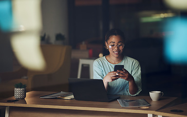 Image showing Woman in dark office with phone, typing or reading email, message or social media post connectivity. Late night at work, cellphone and girl at desk networking, online chat or writing text at overtime