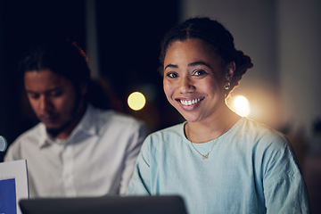 Image showing Overtime, portrait and happy woman in office with laptop, teamwork and typing email, report or review. Night, computer and business people in workplace with smile, online schedule planning and bokeh.