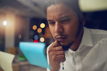 Image showing Businessman, thinking and reading a note in office at night for planning a marketing strategy for professional startup in Egypt. Man, working and idea for corporate company, workplace or overtime