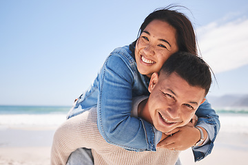 Image showing Happy, piggyback and portrait of a couple at the beach for a date, love or vacation together. Summer, smile and a man and woman with a hug at the sea for a holiday, travel or bonding in marriage