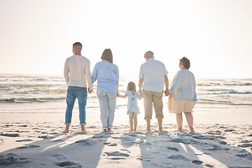 Image showing Summer, relax and holding hands with big family on beach for vacation, bonding and love. Freedom, care and travel with group of people walking at seaside holiday for generations, happiness and mockup