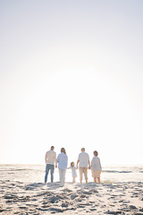 Image showing Love, travel and holding hands with big family on beach for vacation, bonding and summer. Freedom, care and relax with group of people walking at seaside holiday for generations, happiness and mockup