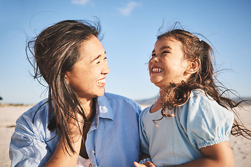 Image showing Laughing, care and a mother and child at the beach for family, travel or summer freedom. Happy, young and a mom with a girl kid at the ocean for a holiday, bonding or together with love at the sea