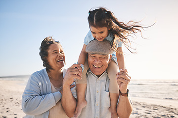 Image showing Happy, beach and girl bonding with her grandparents on a tropical family vacation or adventure. Smile, sunset and child playing with her grandmother and grandfather by the ocean on holiday together.