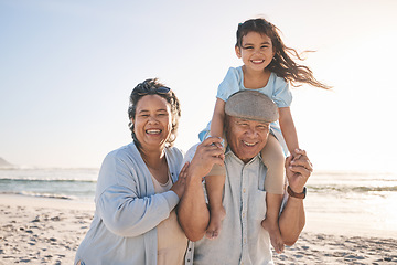 Image showing Happy, beach and portrait of girl with her grandparents on a tropical family vacation or adventure. Smile, sunset and kid bonding with her grandmother and grandfather by the ocean on holiday together