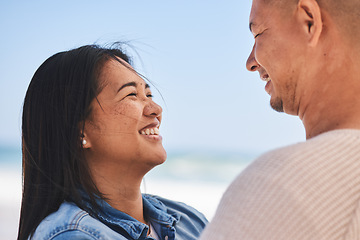 Image showing Happy, couple and love at the beach together for travel, date or a vacation in the summer. Smile, marriage and a man and woman with care on a holiday, the sea for a honeymoon or outdoor walking