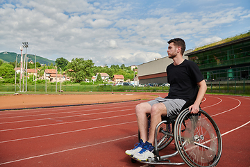 Image showing A person with disability in a wheelchair training tirelessly on the track in preparation for the Paralympic Games