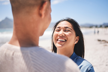 Image showing Love, smile and summer with couple at beach for travel, honeymoon vacation and romance together. Happy, relax and bonding with man and woman walking on seaside holiday for care, date and trip