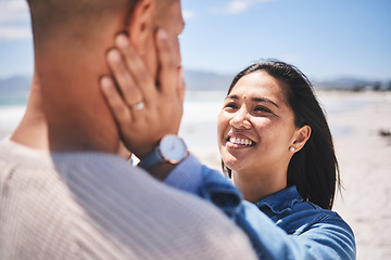 Image showing Beach, love and couple with hands on face for love, commitment and bonding in nature. Travel, summer and man and woman together by ocean for care, trust and affection on holiday, vacation and weekend