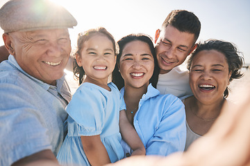 Image showing Happy, selfie and portrait of big family on the beach for tropical vacation or adventure together. Smile, love and girl child taking picture with her parents and grandparents by the ocean on holiday.