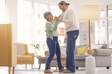 Image showing Home, dancing and a happy mature couple on anniversary, birthday or valentines day celebration. Holding hands, love or care of man and woman with healthy marriage, happiness and moving to music