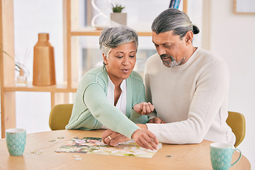 Image showing Puzzle, entertainment and happy senior couple in home for bonding, fun activity and relax together. Retirement, love and man and woman with jigsaw game for playing, hobby and connect in living room