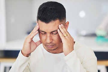 Image showing Man, headache and stress in burnout, debt or financial crisis from depression, anxiety or mental health at home. Frustrated, upset or tired male person with migraine, pain or sore injury in house