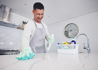 Image showing Kitchen, cleaning and happy man with spray for kitchen, counter or surface care at home. Housework, spring clean and male person smile while using bacteria, dust and dirt control product in a house