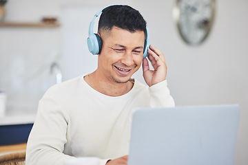 Image showing Remote work from home, smile and man with a laptop, headphones and typing with research for a project. Person, employee or copywriter with a pc, lounge or happiness with connection or search internet