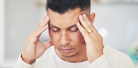 Image showing Stress, headache and man with anxiety, worry or burnout in his home with tension or brain fog. Anxiety, face and guy person with temple massage for migraine, vertigo or mental health problem in house