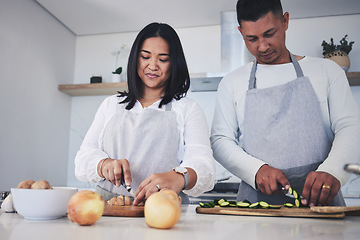 Image showing Help, cooking and love with couple in kitchen for food, health and lunch recipe. Happy, nutrition and dinner with man and woman cutting vegetables at home for diet, wellness and romance together