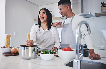 Image showing Laughing, cooking and love with couple in kitchen for food, health and lunch recipe. Happy, nutrition and dinner with man and woman and pasta at home for diet, wellness and romance together