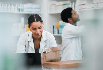 Image showing Woman, pharmacist and team in inventory inspection or checking stock or medication at the pharmacy. People, medical or healthcare professional looking at pharmaceuticals together at the drugstore