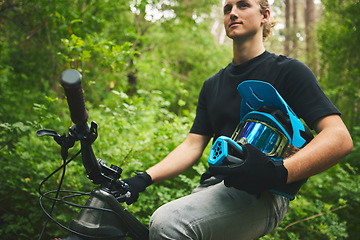 Image showing Mountain bike, man and helmet, nature and sports with adventure and fitness in forest. Cycling outdoor, biker and travel with athlete, exercise training and ready to ride, bicycle and challenge