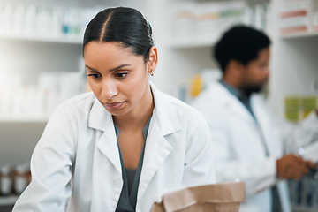 Image showing Pharmacy, medicine and inventory with woman in store for retail, pills and product. Shopping, medical and healthcare with pharmacist and stock for prescription, wellness and supplements dispensary