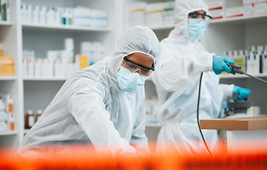 Image showing Pharmacy, emergency disinfection and people spray chemical for protection, cleaning hospital or contamination risk. Safety policy, toxic bacteria outbreak or healthcare team sanitize medical facility