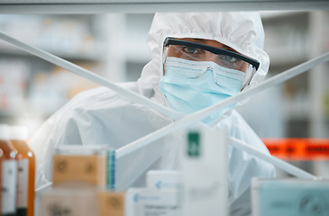 Image showing Lab portrait, PPE and face of person for safety security, cleaning hospital clinic or contamination protection. Product shelf investigation, hazmat suit or healthcare worker for emergency danger risk