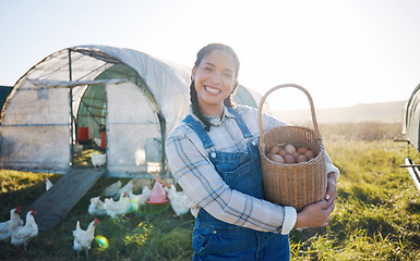 Image showing Happy woman with eggs in basket, farm and chickens on grass in sunshine countryside field with sustainable business. Agriculture, poultry farming and farmer holding produce for food, nature and birds