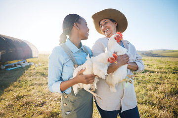 Image showing Happy, team of women and chicken on farm in agriculture, bird or meat production in countryside, field or land outdoor. Smile, poultry farming and collaboration of people in agro for animal livestock