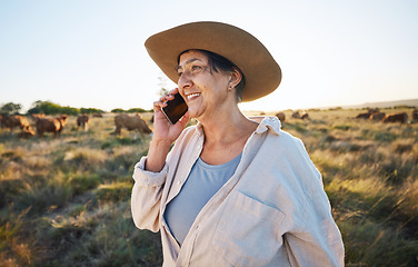 Image showing Woman, farmer and phone call in countryside with cow, person and cattle on farm with smile for live stock in nature. Happy, female worker or social network, connection and communication in rural land