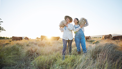 Image showing Farmer, women and agriculture, field and sack of grain with sustainability, partnership and livestock. Cow farm, agro business and team, countryside and environment with support, sunrise and nature