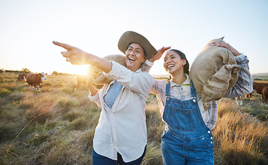 Image showing Hand pointing, happy and women on a farm for sustainability, agro and cattle farming together. Farmer, team female friends in a field for agriculture, eco friendly and livestock, cow or animal check