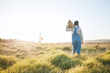 Image showing Walking, bag or farmer farming in nature harvesting production in small business to trade. Back, mockup space or woman working with bag for sustainability or agro development on countryside field